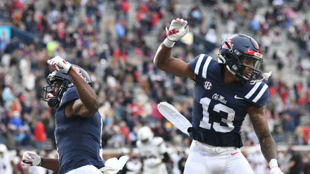 Mississippi wide receiver Braylon Sanders (13) and Mississippi wide receiver Jonathan Mingo (1) celebrate a touchdown against Mississippi State Bulldogs at Vaunt-Hemingway Stadium in Oxford, Miss. on Saturday, Nov. 28, 2020.  (Bruce Newman)